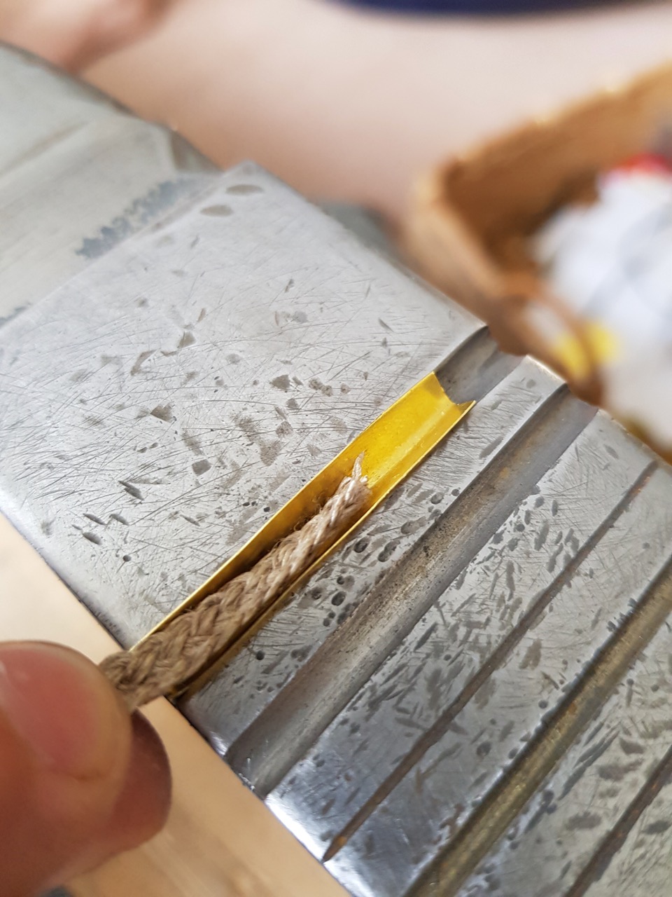 Placing of the cord Cord placed in curved aglet blank