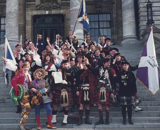 McGillicuddies Brandishing Newspaper Swords on the Steps of Parliament